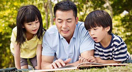 Father reads to children