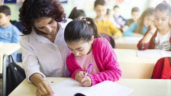 Teacher working with a child