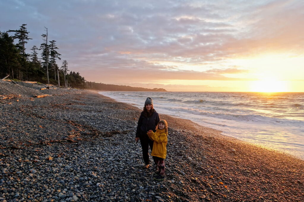Mother and daughter on the beach in Haida Gwaii